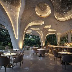 the interior of a modern restaurant with circular lights and round tables in front of them