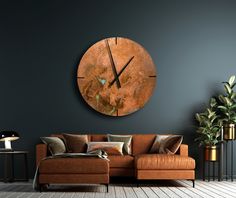 a living room with a couch and a large clock on the wall