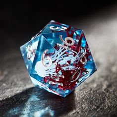 a close up of a dice on a table