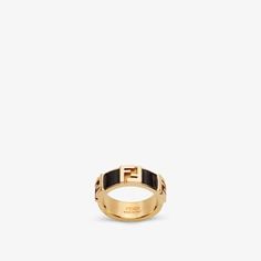 Band ring with embossed FF motif. Made of gold-finish metal. Embellished with black enamelled details. Made in Italy. Size S Black Metal Rings, Fendi Ring, Ring Black, Metal Ring, Gifts Holiday, Color Oro, Black Enamel, Metal Rings, Band Ring