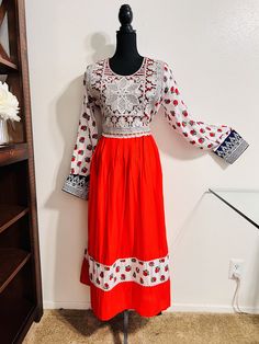 Item# W6 Design: Custom Made Country of Origin: Afghanistan  Price: $80 Material: Cotton, Embroidery, Zipper in back, charma dozi Shoulder: 18 inches Dress Length: 50.5 inches Sleeve Length: 24.5 Waist: 39 inches Chest: 42 inches This is beautiful Afghan short dress with embroidered around its neck and beautiful design Festival Dresses With Geometric Embroidery, Red Long Sleeve Embroidered Dress For Festivals, Fitted Long Sleeve Dress With Embroidered Border, Festive Geometric Embroidered Dress, Festive Dress With Geometric Embroidery For Festivals, Festive Dresses With Geometric Embroidery, Geometric Embroidery Dresses For Festivals, Long Sleeve Floral Embroidery Dresses For Festivals, White Embroidered Dress For Holidays