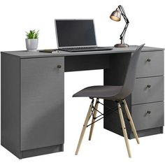 a computer desk with a laptop on top of it and a chair next to it