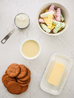 cookies, butter and other ingredients are on the counter next to a bowl of cheese