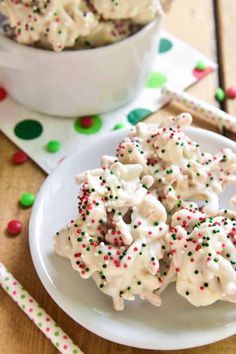 some cookies are on a plate with sprinkles