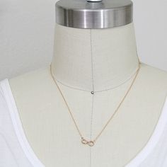 "Beautiful and lovely tiny infinity pendent necklace. Made of hammered rose gold plated infinity pendent with skinny rose gold plated chain. Soft and warm. Great for gift , everyday or special occasion. Your item will ship in a gift box. Please feel free to contact me if you have any question. ♥ Length available 14\" -20\" ♥ Pendent 5/8\" x 1/4\" ♥Rose gold plated over brass ♥ Delivery Time Fast shipping within 1 - 3 days ♥ See more Rudiana Accessories Rudiana.etsy.com" Necklace Infinity, Necklace Rose Gold, Infinity Necklace, Pendent Necklace, Necklace Rose, Jewelry Stand, Necklace Dainty, Rose Gold Necklace, Gold Plated Chains