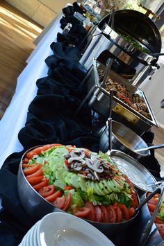 a buffet table filled with different types of food