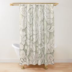 a shower curtain with white lace on it