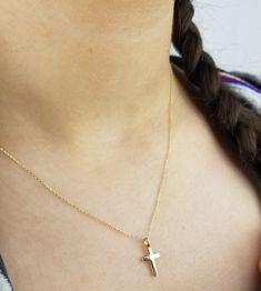 14K SOLID YELLOW GOLD SMALL CROSS NECKLACE Here is a dainty, delicate and simple, yet classy minimalist Cross Necklace. This is 14k Solid Gold. (We do not sell filled or plated jewelry) Perfect for everyday use. Metal : 14K Solid Gold Necklace Length : 17 inches / 42.5cm Cross Height : 16mm Cross Width : 8mm ---Absolutely stunning. Comes in a gift box. ---Shipping Policy---- Item will be shipped within 1-3 business days of receiving full payment. ---Return Policy--- -You may return the unused it Gold Personalized Minimalist Cross Necklace, Gold Minimalist Personalized Cross Necklace, Minimalist Personalized Gold Cross Necklace, Dainty Gold Cross Necklace For Baptism, Gold Hypoallergenic Cross Necklace, Minimalist Cross Jewelry For First Communion, Minimalist Gold Jewelry For Baptism, Dainty Gold Jewelry For First Communion, Yellow Gold Cross Necklace