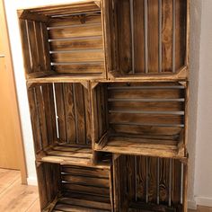 an old wooden crate is sitting on the floor