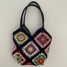 MADE TO ORDER  Introducing our exquisite Floral Crochet Tote Bag - a stunning blend of functionality and elegance! Handcrafted with meticulous attention to detail, this bag epitomizes artisanal mastery. 🌸 Intricate Design: Unlike the classic granny square motif, our bag features charming floral patterns against a sleek black backdrop. Each motif is delicately crocheted using premium cotton yarn, ensuring both durability and a touch of sophistication to your attire. 👜 Versatile Style: Designed Black Square Crochet Bag With Large Capacity, Trendy Multicolor Bucket Crochet Bag, Trendy Multicolor Crochet Bucket Bag, Large Capacity Black Square Crochet Bag, Multicolor Large Capacity Crochet Bucket Bag, Multicolor Large Capacity Bucket Crochet Bag, Multicolor Crochet Shoulder Bag Gift, Multicolor Pouch Beach Bag, Trendy Multicolor Handheld Crochet Bag