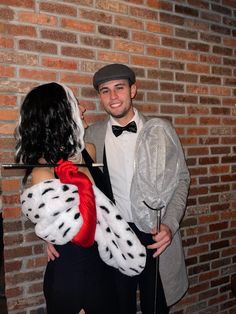 a man and woman dressed up in costumes