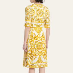 Dolce&Gabbana printed charmeuse dress Round neckline Elbow-length sleeves Side seam pockets A-line silhouette Knee length Back zip Silk/spandex Made in Italy Elegant Printed V-neck Midi Dress, Luxury Fitted A-line Midi Dress, Designer Silk Dress With Floral Print, Designer Silk Floral Print Dress, Luxury Floral Print Summer Dress, Luxury White A-line Dress, Formal Printed V-neck Dress, Elegant Yellow Silk Dress, Elegant Mid-length Floral Print Dress