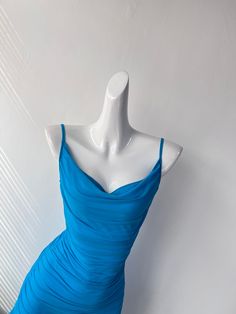 Aiming to impress, this chic blue dress features an eye-catching asymmetrical hem and intricate ruched detailing that enhances its overall elegance. The playful yet sophisticated silhouette makes it an ideal choice for those who want to stand out at any event. Its lightweight material drapes gracefully, ensuring a flattering fit for various body types. The vibrant blue hue captures the essence of both the ocean's depth and the sky's clarity, making it a striking choice for both daytime and eveni Chic Blue Dress, Summer Maxi Dress Floral, Column Wedding Dress, Stylish Maxi Dress, Dynamic Movement, Asymmetrical Cut, Blue Beauty, Blue Tulle, Natural Line