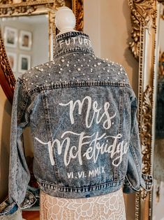 the back of a jean jacket that says, mrs mckeridge in white ink