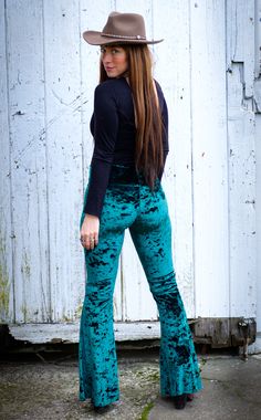 The Slim Bell Pants are the go to every day pant aka "the yoga pants." These puppies should be in constant rotation in your closet. We have taken our Flow Pant and toned it down on the flare and turned it up on the fit from hip to knee. Design Features: Wider waist band hits just under belly button Low rise center seam Hugs hips and legs to knee Slight flare at knee Great for every day, dance, movement, hooping and yoga Made in San Francisco, CA, USA Fabric Features: Rich green soft crush velvet Forest Green Pants, Green Velvet Pants, Velvet Bell Bottoms, Bell Bottoms Outfit, Rave Outfits Festivals, Festival Clothes, Velvet Flare Pants, Warrior Within, Hippie Clothing