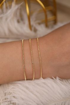 14k Gold Ball Chain Bracelet, Solid Gold Bracelet, Yellow Gold Dainty Chain, Bracelet Stack, Dainty Gold Bracelet, A Great Gift, Selena Wear it by itself or stack them up with your other bracelets ⁕⁕ Handmade ⁕⁕ Solid Gold ⁕⁕ Chain Width : 1mm - 1.3mm - 1.5mm ⁕⁕ High-End Polish Orders with free shipping go out with USPS First Class Mail tracking. We require a signature for orders more than $500. If you need a signature required service, you can select that service in the shipping options on your Minimalist Chain Bracelet With Round Beads And Adjustable Chain, Dainty Chain Bracelet With Adjustable Round Beads, Minimalist Adjustable Chain Bracelet With Round Beads, Elegant Round Charm Bracelet With Box Chain, Elegant Charm Bracelet With Box Chain, Gold Bracelets With Satellite Chain As Gift, Gold Bracelets With Satellite Chain For Gift, Adjustable Rose Gold Bracelet With Satellite Chain, Elegant Jewelry With Box Chain And Round Beads