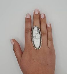 "These beautiful Sterling Silver rings come in either White Buffalo or Black Onyx, sizes 6 to size 10. These rings are handmade, they are over 2\" long and guaranteed to be Sterling Silver. These rings are truly unisex rings and they look equally as good on men as they do on women! PLEASE SPECIFY SIZE AND COLOR IN \"NOTE TO SELLER\" WHEN ORDERING I also have white buffalo and black onyx cuff bracelets and cluster bracelets that make the perfect compliment to this gorgeous statement ring.  Check out my other listings to complete your look!" Unisex Rings, Big Statement Rings, White Buffalo Turquoise, Handmade Jewelry Ring, Cluster Bracelets, Black Onyx Ring, Handmade Jewelry Gift, White Buffalo, Unisex Ring