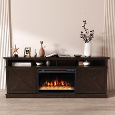 an entertainment center with a fireplace in the middle