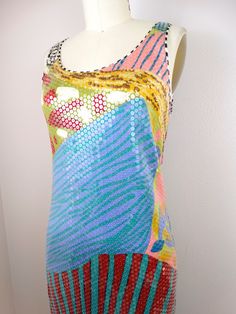 "This is such a rare dress from Missoni. It's fully embellished with clear sequins on silk with a funky abstract design. It's in excellent condition! Measurements: (note, there's a little stretch in the material) Bust - 32-36\" Waist - 30-34\" Hips - 36-40\" Total Length - 39\" This dress comes from a pet-free and smoke-free home. If you would like more info or have any questions, please don't hesitate to ask!" Sleeveless Sequin Dress With Rhinestones For Summer, Embellished Multicolor Sequin Dress For Summer, Embellished Multicolor Sequin Summer Dress, Multicolor Embellished Sequin Dress For Summer, Multicolor Embellished Sequin Summer Dress, Fitted Multicolor Sequin Fabric For Summer, Fitted Summer Dress With Mirror Work, Summer Fitted Dress With Mirror Work, Summer Party Dress With Mirror Work