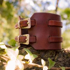 Mahogany brown leather cuff bracelet adjustable to all wrist sizes using buckles. Made from scraps of vegetable-tanned leather, hand-dyed. The manufacturing is entirely artisanal. Width: 5cm Careful shipping with tracking. Items are carefully packaged in recyclable or recycled packaging. Brown Leather Cuff Bracelet With Strap, Brown Leather Strap Cuff Bracelet, Brown Cuff Bracelets With Waxed Finish, Brown Cuff Bracelet With Wrist Strap, Adjustable Brown Leather Bracelet With Belt Detail, Brown Leather Cuff Bracelet With Wrist Strap, Adjustable Brown Leather Belt Bracelet, Rustic Brown Leather Strap Cuff Bracelet, Artisan Brown Leather Cuff Bracelet