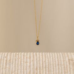 The Sapphire Teardrop Necklace is a beautiful choice for those looking for a timeless and meaningful accessory or a thoughtful gift for someone special. This particular necklace showcases a teardrop-shaped pendant adorned with a sapphire gemstone. Sapphire is the birthstone for the month of September, making it a meaningful gift for those born in that month or anyone who appreciates the beauty of sapphire. Material: High Quality Solid 925 Sterling Silver Finish: Sterling Silver ∙ 18K Gold Featur Elegant Sapphire Teardrop Necklace, Luxury Sapphire Dainty Necklace, Gold Teardrop Sapphire Necklace, Elegant Pear-shaped Sapphire Necklace, Sapphire Gemstone Pear-shaped Necklace, Aquamarine Stacking Ring, Month Of September, Pearl Anklet, Curb Chain Necklace