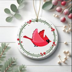 a ceramic ornament with a red bird on it