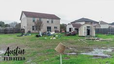 the yard is littered with debris and junk