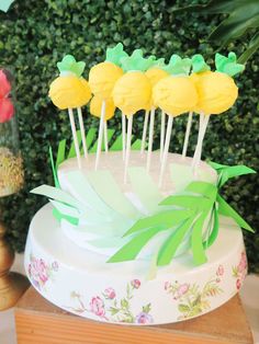 the cake is decorated with yellow and green icing