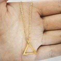 Design: Geometric Triangle Pendant Necklace - Fire Element Sign Metal: 925 Sterling Silver Plating: 18K Gold Plated Chain Type: Link Chain Chain Length: 16 Inch + 3 Inch Extension Chain/ 41 cm + 7 cm Extension Chain Pendant Size: 5 Inches x 6 Inches HESTIA: Goddess of the Hearth and Its Fires. Gold Triangle Metal Jewelry, Gold Triangle Brass Jewelry, Triangle Necklace With Adjustable Chain For Gift, Minimalist Gold Triangle Jewelry, Minimalist Triangle Gold Jewelry, Gold Triangle Necklace For Gift, Triangle Brass Jewelry Gift, Dainty Gold Triangle Jewelry, Hestia Goddess