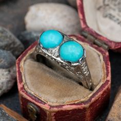 This fascinating twin turquoise cabochon ring is crafted of 18k white gold. This ring is currently a size 7.5. The turquoise show visible epoxy around the stones to help keep them secure. Vintage Turquoise Jewelry Rings, Turquoise Jewelry Rings, Vintage Turquoise Jewelry, Vintage Turquoise Ring, Cabochon Ring, Turquoise Rings, Vintage Turquoise, High Quality Jewelry, Turquoise Jewelry