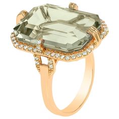 This Prasiolite Emerald Cut Ring from the 'Gossip' Collection is a stunning piece of jewelry that exudes elegance and sophistication. Crafted in exquisite 18K yellow gold, the centerpiece of this ring features a mesmerizing emerald-cut prasiolite gemstone. This vibrant green gem is beautifully complemented by a halo of dazzling diamonds, adding a touch of glamour and luxury to the design. With its timeless appeal and exceptional craftsmanship, this ring is the perfect accessory for those who app Emerald Cut Ring, Crystal Goddess, Emerald Cut Rings, Diamonds Ring, Green Gems, Modern Ring, Classic Ring, Rock Crystal, Modern Jewelry