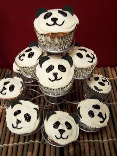 there are many cupcakes with panda faces on them