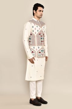 Ivory bundi with thread, sequin embroidery in mughal floral pattern. Paired with floral embroidered kurta and pant pyjama. - Aza Fashions Fitted White Bollywood Nehru Jacket, White Fitted Bollywood Nehru Jacket, Fitted White Nehru Jacket With Zari Work, White Fitted Nehru Jacket With Zari Work, Designer Off-white Bandhgala With Cutdana, Off White Cutdana Bandhgala For Eid, White Bandhgala With Cutdana For Reception, White Bandhgala With Intricate Embroidery For Festive Occasions, Festive White Bandhgala With Intricate Embroidery