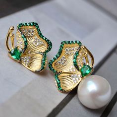 💚💚 Specifics: Materials: Natural freshwater Pearl With 925 Silver And Zircon Earrings Size: 12mm*22mm Pearl Diameter: 10mm*10mm Closure: the closure is made of 925 sterling silver.  Handmade Artwork, original design and copyright protected  Metal: Gold plated s925 silver 💚💚Shipping We ship it in 5-7 days after the payment is made and you may choose your personalized shipping services. We shipping world wide and it is free international shipping. Please kindly be reminded that we are not resp Green Pearl Earrings As Gift, Green Pearl Earrings For Gift, Fine Jewelry Green Pearl Earrings For Gift, Green Pearl Earrings For Anniversary, Green Pearl Earrings For Wedding, Green Pearl Drop Earrings For Anniversary, Elegant Green Pearl Earrings For Pierced Ears, Elegant Green Pearl Earrings Gift, Pearl Studs Earrings