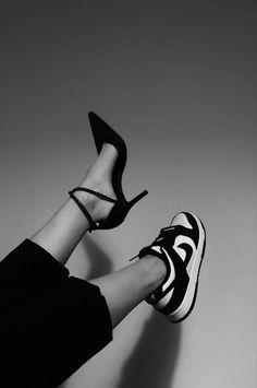 black and white photo of woman's legs wearing high heels