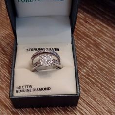 a diamond ring in a box on a table