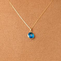 "In the form of a trendy evil eye necklace, we've got a solid protection for you and your loved ones. It's time to put on an excellent outfit to guard off the negative energy around you. With the small 14k gold evil eye necklace, you can show your affection for your loved ones. D E T A I L S * Made to Order. * 100% 14k Solid Gold * Choice of Gold Color: Yellow Gold, Rose Gold, White Gold * Pendant Height: 11 mm / 0.43 inch * Pendant Width: 11 mm / 0.43 inch * Length: 14\", 16\", 18\", 20\", 22\" Yellow Gold Evil Eye Spiritual Necklace, Spiritual Yellow Gold Evil Eye Necklace, Yellow Gold Evil Eye Jewelry For Good Luck, Gold Plated Evil Eye Round Pendant Jewelry, 14k Gold Evil Eye Amulet Jewelry, Blue Birthstone Gold-plated Jewelry, Blue Birthstone Jewelry In Gold Plated, Blue 14k Gold Necklace With Adjustable Chain, Blue Gold-plated Birthstone Jewelry