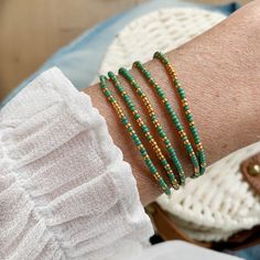 Beautiful delicate wrap bracelet, wraps around your wrist 5 times. Lovely color combination of green with a hint of golden seed beads which gives the bracelet a lovely sparkle. M A T E R I A L * Delica Seed beads from Miyuki ( 2 mm) green & gold * Very strong elastic S I Z E Size medium, 86 cm ( 34 inch), 6.7 inch when wrapped, fits the normal to small wrist. Can be made in any size ( please sent me a message with your order and it will be made for you) S H I P P I N G * All orders are wrapp Peridot Bracelet, Boho Wrap Bracelet, Bracelet Initial, Black Beaded Bracelets, Zodiac Bracelet, Birthday Bracelet, Turquoise Bead Bracelet, Seed Bead Bracelet, Simple Bracelets