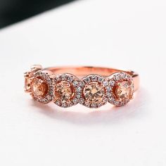 Rose Gold Halo Five Stone Champagne Stone RingEmbedding diamonds by handcraft. Exquisite design made perfect for an engagement ring, wedding ring, promise ring, bridal ring set, anniversary ring, couples ring, and more. Wonderful gifts for birthdays, Mother's Day, Valentine's Day, Thanksgiving, Christmas, and all other occasions.Our mission is to create premium stones that shine like a natural diamond. Gemstone types, shapes, colors, and cuts were carefully designed and handcrafted to perfection