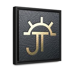 a black and gold sign with the letter j on it