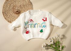 This Christmas, dress your little one in our specially designed Christmas sweaters and cardigans to add even more joy to the holiday season! 🎄 Our Christmas baby sweaters and cardigan collection are not only soft and cozy but can also be personalized with your baby's name or monogram, making each sweater unique. Whether it's adorable Santa, snowflake patterns, or little reindeer designs, these sweaters perfectly capture the festive spirit of Christmas. 🎅🏼 Crafted with care for newborns to you Sweater With Name, Baby Name Sweater, Baby Christmas Sweater, Christmas Baby Clothes, Newborn Sweater, Christmas Gift For Baby, Cardigan Collection, Sweater Unique, Name Sweater