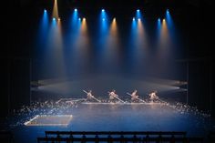 the stage is lit up with blue lights