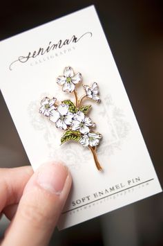 White Dogwoods Soft Enamel Pin by SenimanCalligraphy on Etsy https://www.etsy.com/listing/688831099/white-dogwoods-soft-enamel-pin Spring Gift Enamel Pin, Spring Flower Enamel Pin For Gift, Spring Flower Enamel Pin As A Gift, Spring Flower Enamel Pin Gift, Enamel Pin Collection, Jacket Pins, Bag Pins, Floral Pins, Pretty Pins