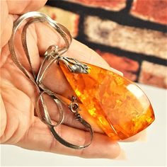 "Huge NATURAL AMBER STERLING Pendant, 925 Silver Chain 15\", Freeform Honey Baltic Amber Irregular Stone, Unique Amber Gift For Her by ANTIQUE4YOU IRREGULAR GENUINE BALTIC AMBER ORANGE STONE PENDANT WITH NATURAL INCLUSIONS. FREEFORM 3D STONE. PLACED ON 15\" STERLING SILVER CHAIN. PENDANT SIZE 3\" x 1.25\" x 5/8\" in HEIGHT. GREAT GIFT FOR HER. UNISEX PENDANT. *BEFORE PLACING ORDER, PLEASE, MAKE SURE YOUR ADDRESS IS CORRECT IF YOU PLACED ORDER WITH UNVERIFIED ADDRESS OR HAD MISTAKE IN IT AND IF P Silver Chain Pendant, Orange Stone, Natural Amber, Chain Pendant, Baltic Amber, Stone Pendant, Stone Pendants, Sterling Silver Chains, Silver Chain