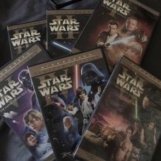 star wars dvd's sitting on top of a black bag