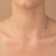 ✦ Dot Chain Necklace ✦  ✧ DESCRIPTION & DETAILS The Dot Chain Necklace is a versatile and stylish gold chain necklace.  This 14k solid gold necklace is high on style, yet affordable enough to be paired with everyday outfits.  The necklace's simple design will bring every outfit up a notch! ❶ 100% 14k solid gold. ❷ Waterproof you can wear it everywhere and anywhere ❸ Available lengths: 14 to 18 inches. The chain thickness of 1.00 mm. ❹ Disc Size: 3.00mm  ❺ Disc's width: 1.00mm ✧ MATERIALS - I only work with high-quality, enduring materials, from precious metals to chains, with genuine gemstones and ethically sourced diamonds. My pieces are made for everyday wear, forever. I also have a few tips and tricks you can use to keep your piece looking brand new. - All pieces are packed in Gift Boxe 14k Gold Round Charm Necklaces, Gold Sterling Silver Drop Necklace, Gold Sterling Silver Round Drop Necklace, Gold Sterling Silver Drop Necklace With Round Shape, Yellow Gold Dangle Clavicle Chain Necklace, Yellow Gold Dangle Clavicle Necklace, 14k White Gold Dangle Necklaces, Delicate Yellow Gold Necklace With Charms, White Gold 14k Dangle Necklaces