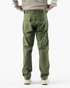 orSlow Slim Fatigue Pants Green. Military trouser made with a heavy duty cotton twill. Featuring two front and back pockets and a zip fly. 100% Cotton Branded patch Indigo dyed 9oz denim from Japan Custom orSlow brass buttons Custom Labels Wash cold, hang dry Made in Japan Teagan is 6'2 and wearing a size 2 orSlow orSlow, founded my Ichiro Nakatsu, has become globally renowned for pairing rugged construction with refied details. Inspired by Americana, denim is the brands hallmark. Known for reco Custom Labels, Fast Fashion, Slow Fashion, Cotton Twill, Childrens Clothes, Fatigue Pants, Brass Buttons, Pants Green, Indigo Dye