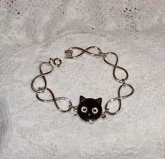 Interchangeable Snap Charm Bracelet. Snap Buttons are pressed into the base and can be just as easily removed to replace with another Snap of your choice. with Black Cat Center Snap. Bracelet is 7" long. Cat Snap, Chain Charm Bracelet, Bracelets And Charms, Black Cat, Jewelry Bracelets, Charm Bracelet, Fashion Jewelry, Bracelet, Chain