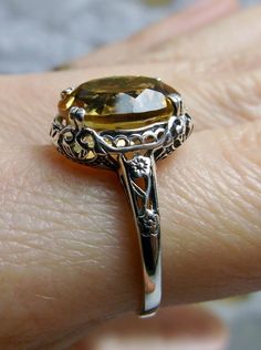 Natural Citrine Ring, Oval yellow citrine gemstone, sterling silver floral filigree, Edward Design #D70z, front view on a mirror Edwardian Jewelry, Yellow Citrine, Citrine Ring, Natural Citrine, Citrine Gemstone, Filigree Ring, Citrine, Natural Gemstones, Silver Rings