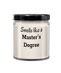 a white jar with black lid that says smells like a master's degree on it